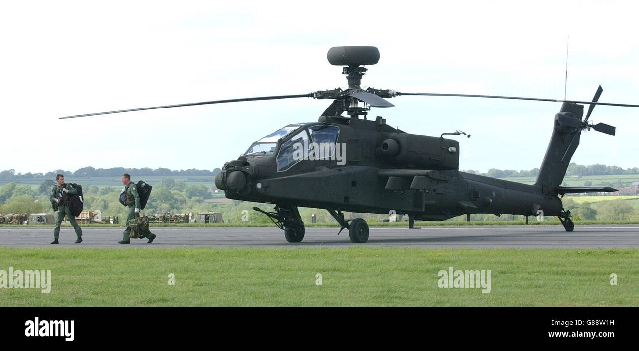 Crew leave an Apache attack helicopter. The Army's new generation of attack helicopters, the Apache AH MK1, was declared fully operational. Stock Photo