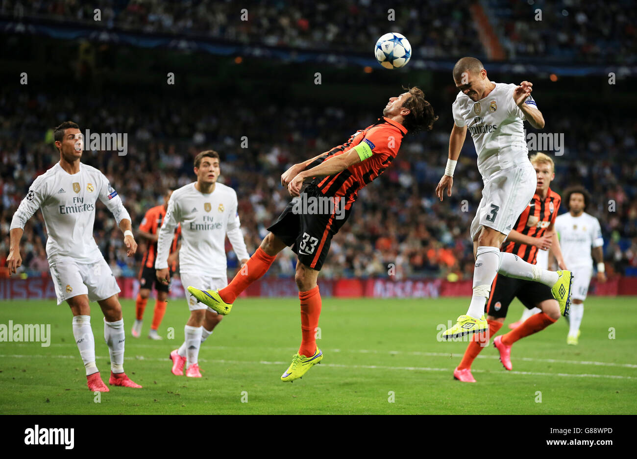 Real Madrid's Pepe wins header beating Shakhtar Donestsk's Darijo Srna Stock Photo