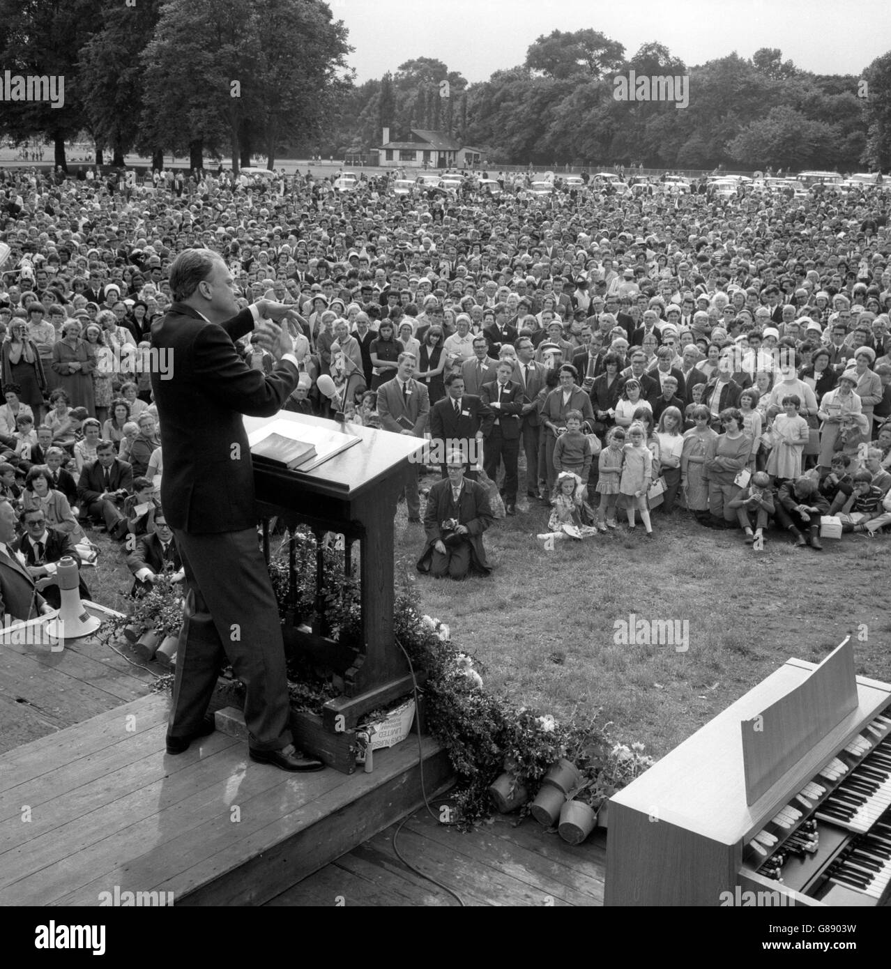 American evangelist Dr Billy Graham preaches to the crowd at a open-air ...