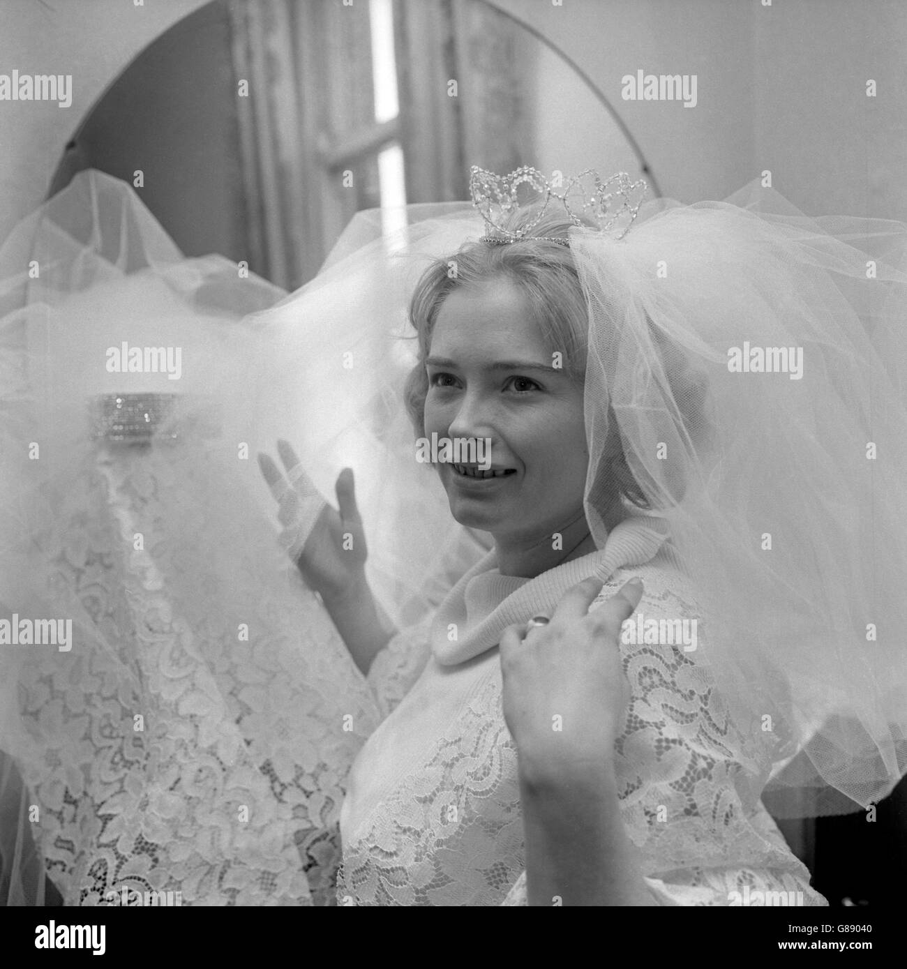 Pauline Ledder, 25, of Templars Way, Bradford, meets a new bridegroom at the altar every month. It started off as a hobby, but now Pauline's weddings have mushroomed into a full-scale business venture. When she started making bridal gowns - she is pictured here in one of her own creations - she decided it was part of her job to see that the day runs smoothly by offering advice to a wife-to-be on her wedding day. Stock Photo