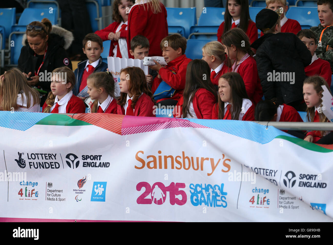 Spectators cheer on the girls triple jump at the Sainsbury's 2015