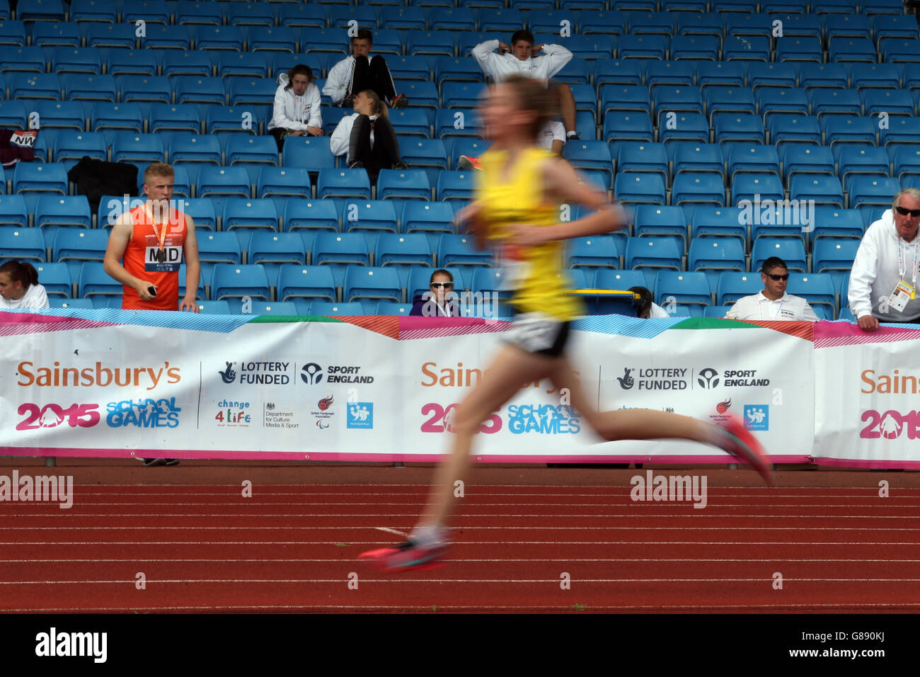 Sport - Sainsbury's 2015 School Games - Day Two - Manchester. The girls 3000m runners make their way past the cheering crowd at the Sainsbury's 2015 School Games at the Manchester Regional Arena. Stock Photo