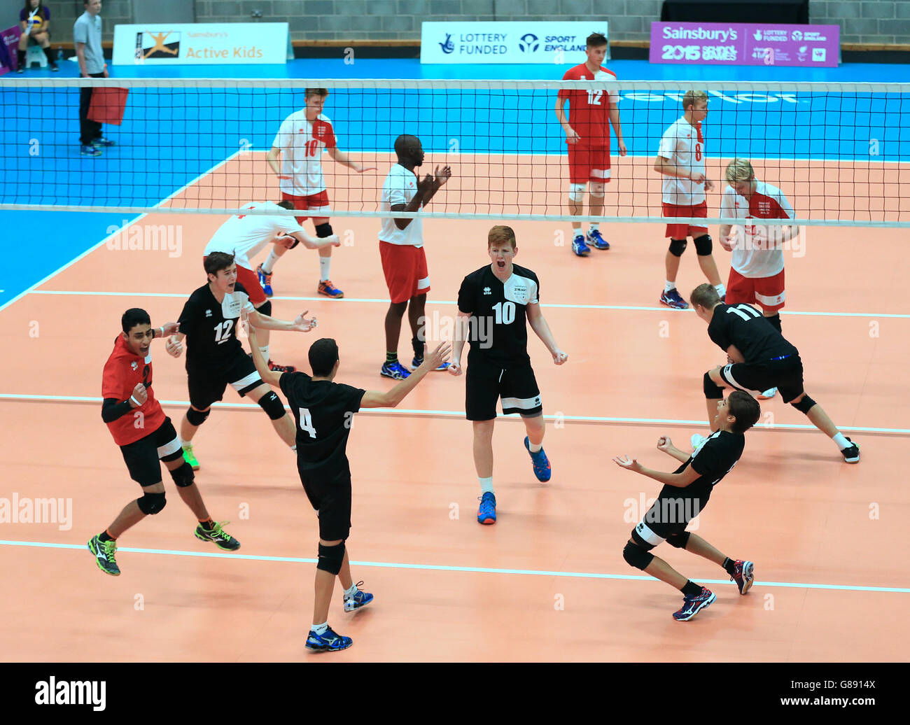 England Cadet Men volleyball team (near side) celebrate victory over