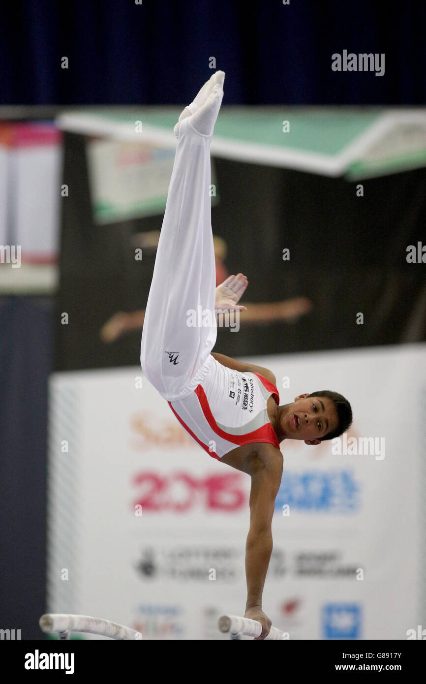 England's Joshua Nathan performs the parallel bars during the Sainsbury's 2015 School Games in Manchester. Stock Photo