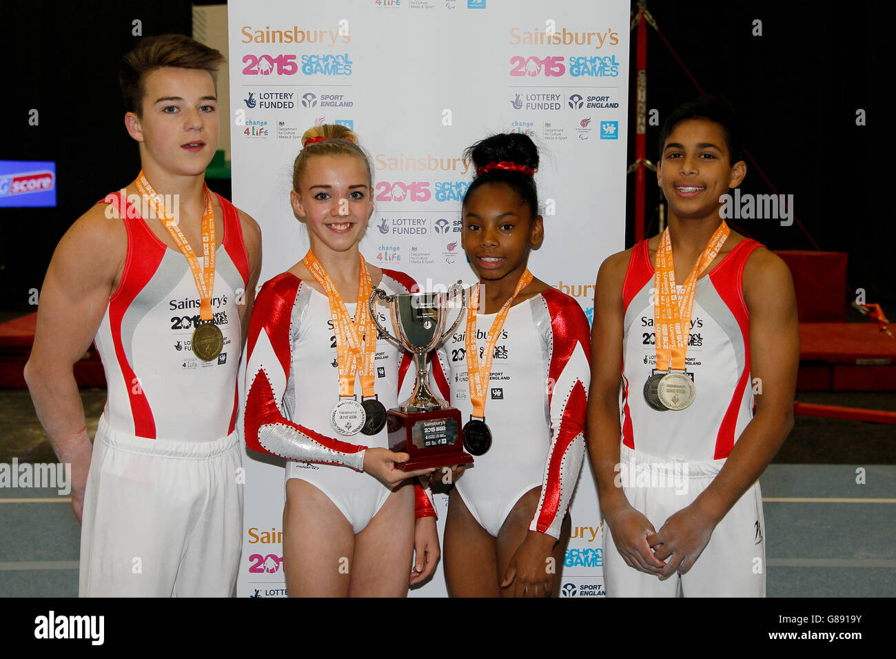 English gymnasts pose after the awards ceremony during the Sainsbury's 2015 School Games in Manchester. Stock Photo