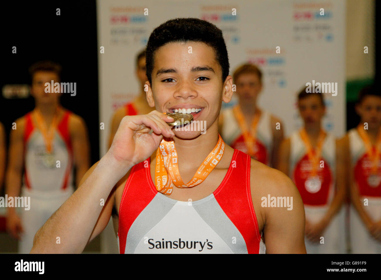 Sport - Sainsbury's 2015 School Games - Day Two - Manchester. England's Jamie Lewis bites his medal during the Sainsbury's 2015 School Games in Manchester. Stock Photo