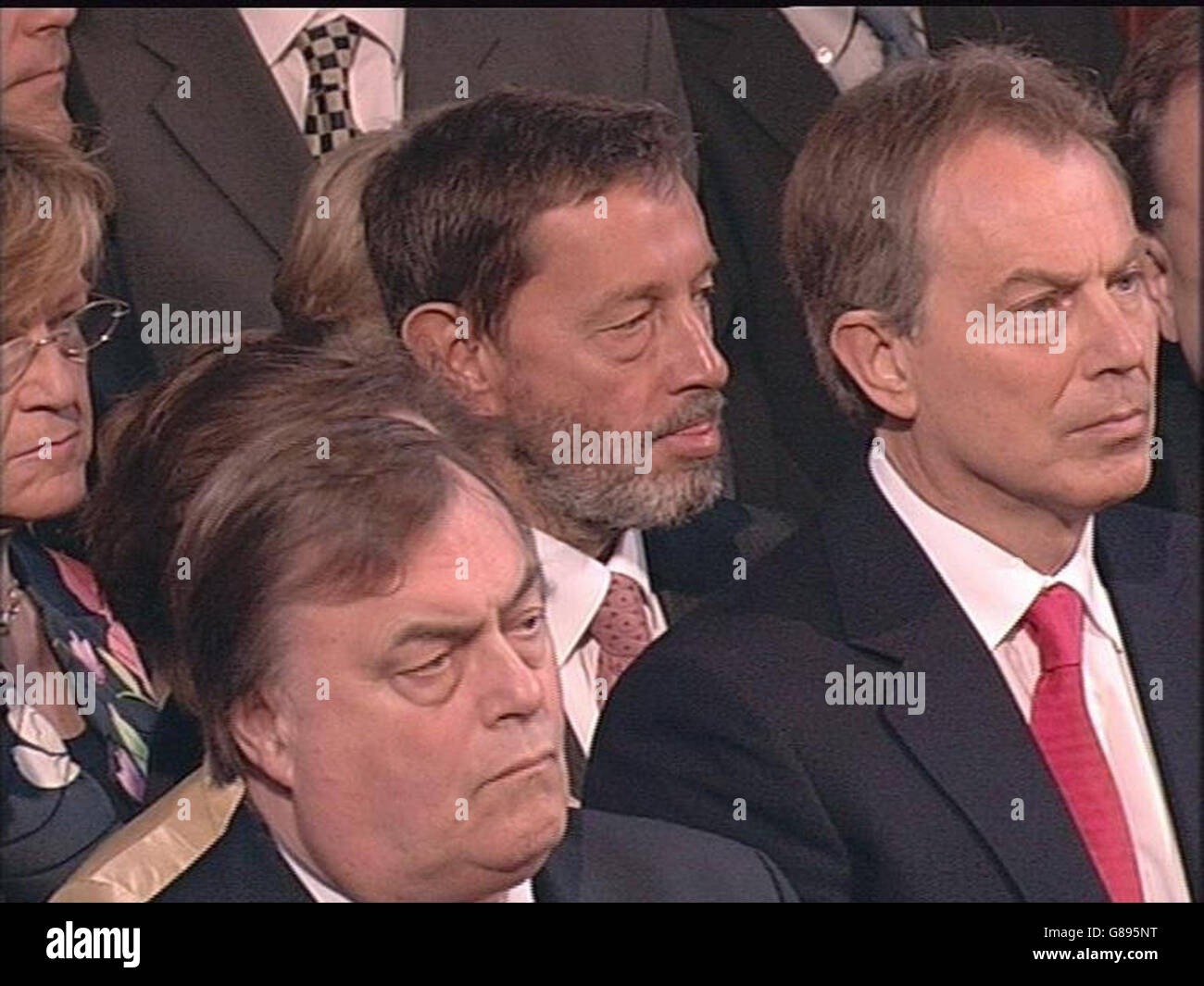 (Left to right:) Deputy Prime Minister John Prescott, Secretary of State for Work and Pensions David Blunkett and British Prime Minister Tony Blair listen as Britain's Queen Elizabeth II makes a speech in the House of Lords during the State Opening of Parliament in which she outlined the government's legislative programme for the new parliamentary session following the Labour Party's return to power in the General Election earlier this month. Stock Photo