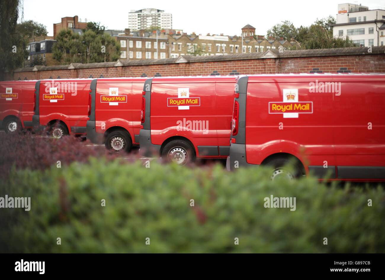 A row of Royal Mail delivery vans parked at Mount Pleasant Mail Centre