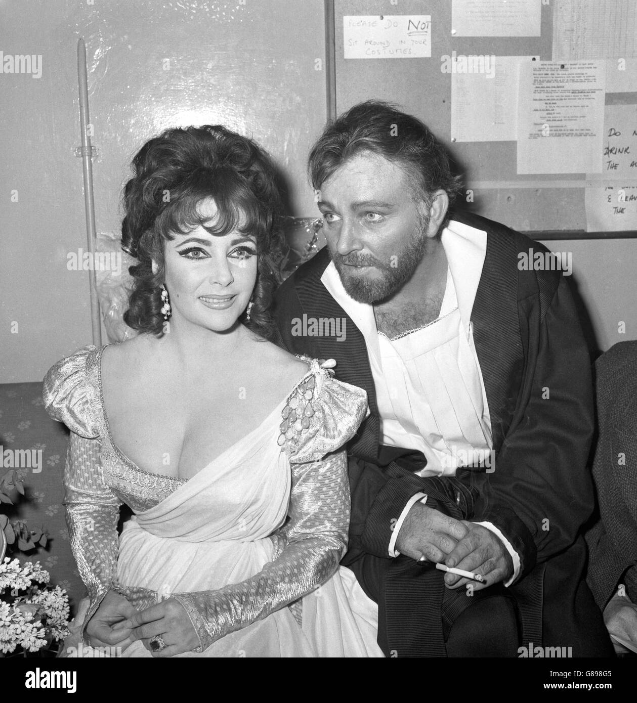 Elizabeth Taylor and Richard Burton after appearing in the first night of the Oxford University Dramatic Society production of Marlowe's Dr Faustus at the Playhouse Theatre. Mr Burton played the title role and wife played the non-speaking part of Helen of Troy. When the play ended last night, the cast took 15 curtain calls and enjoyed over nine minutes of applause. Stock Photo