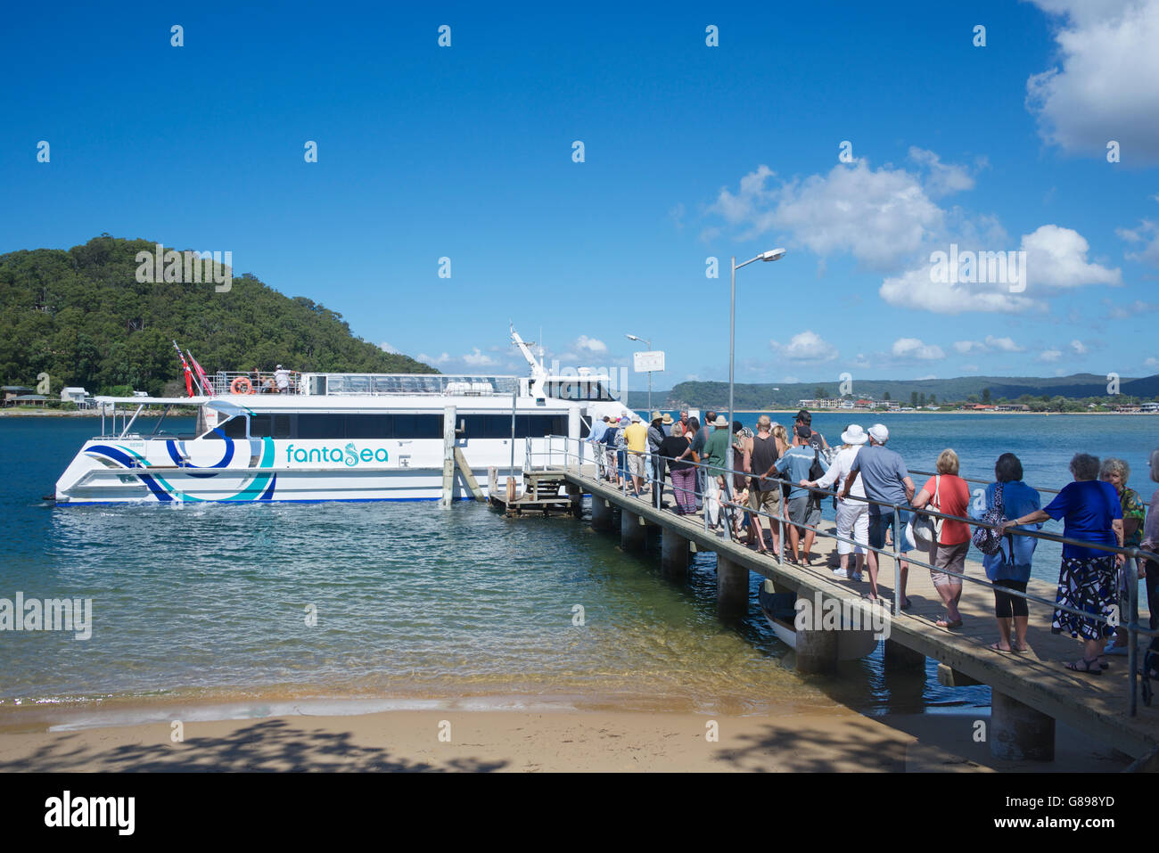 Passenger boarding Palm Beach to Ettalong Beach ferry Ettalong Central Coast NSW Australia Stock Photo