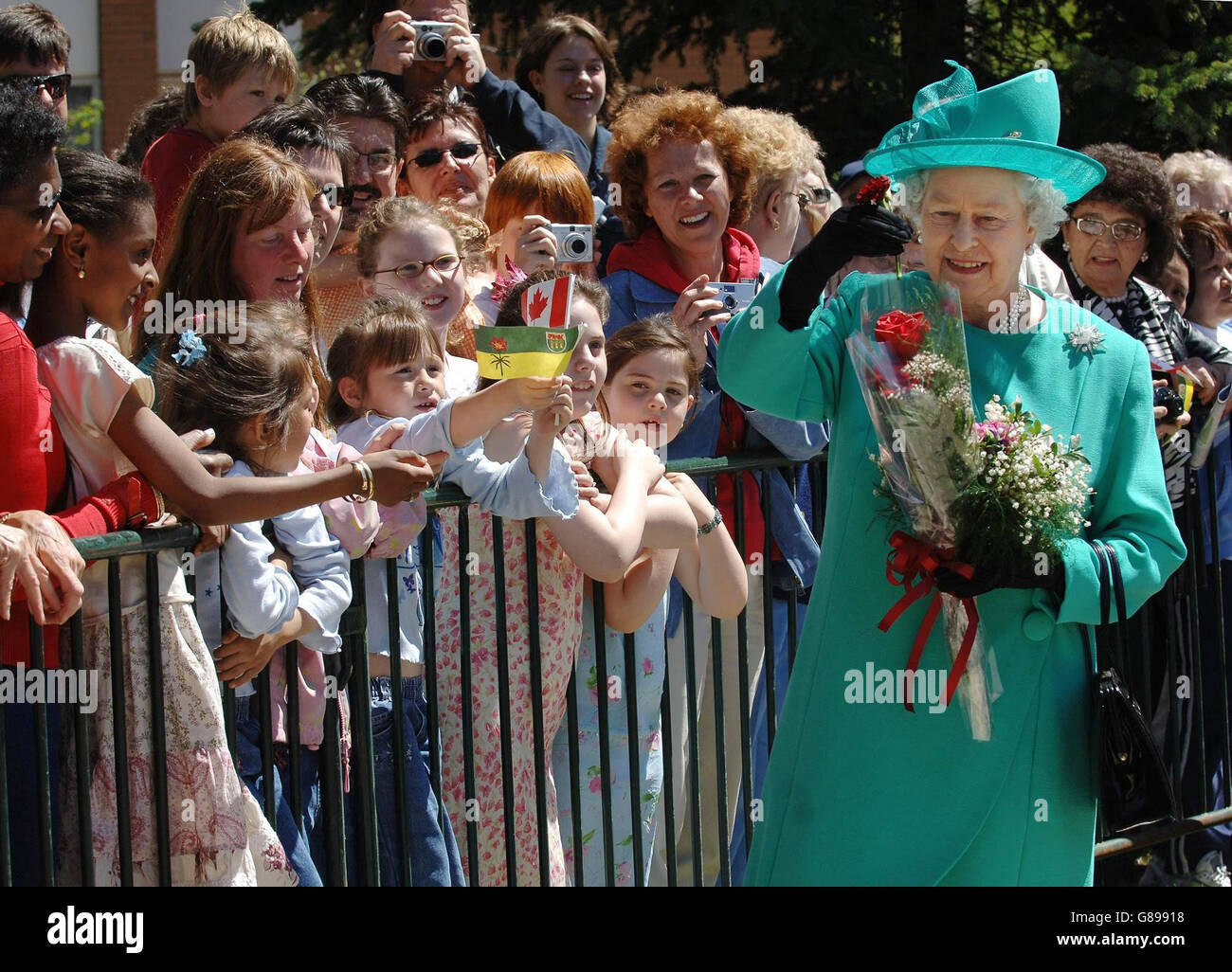 Britain's Queen Elizabeth II greets the crowds after leaving Government House in Regina, Saskatchewan. Stock Photo