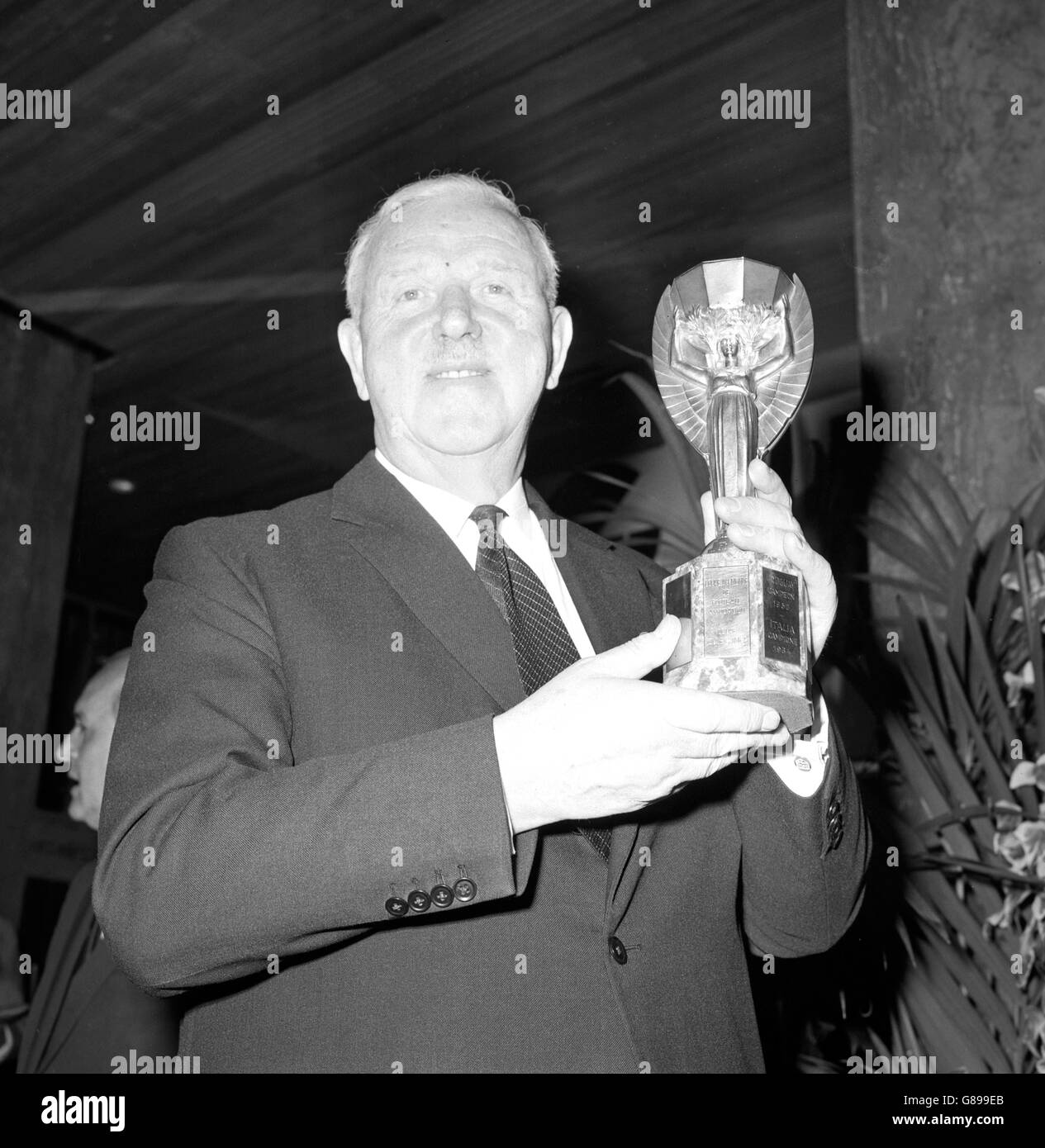 Sir Stanley Rous, president of FIFA (left) with the Jules Rimet Cup at the Royal Garden Hotel in Kensington. The draw for the World Cup finals will take place tomorrow. Stock Photo