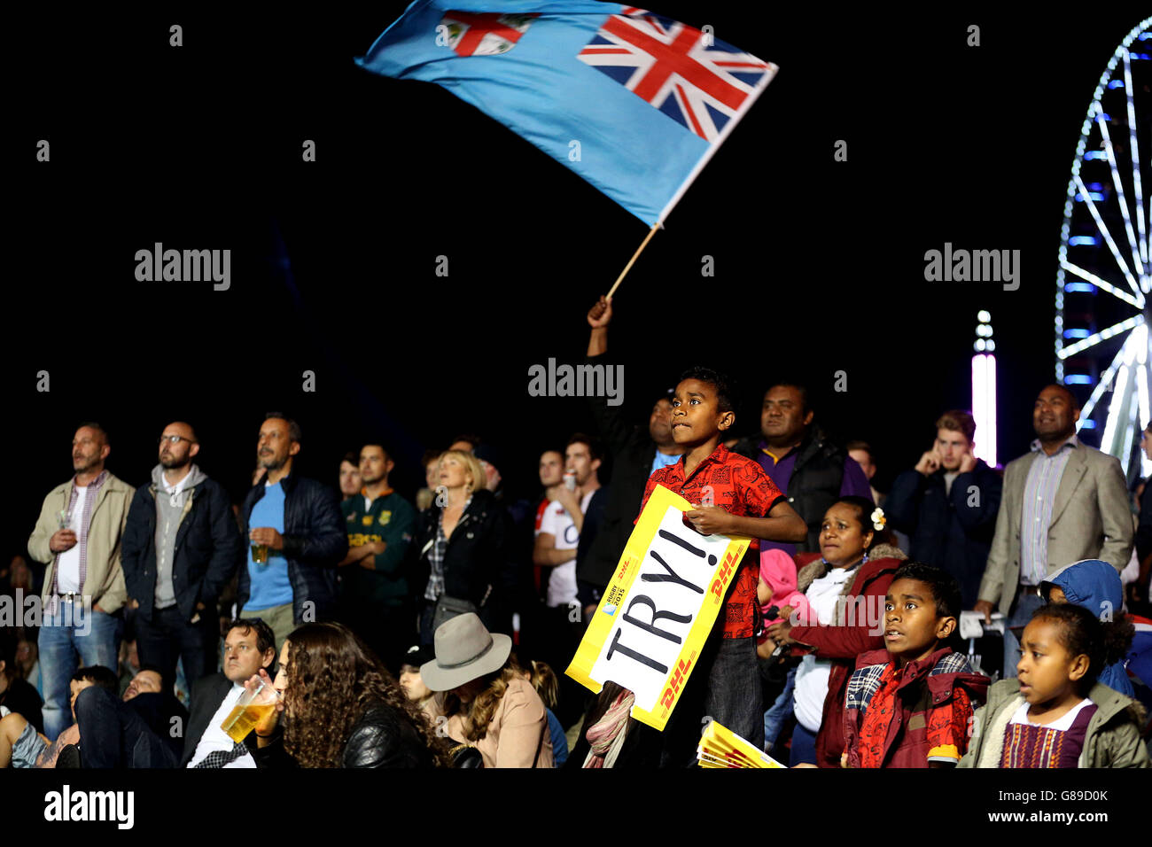 Fiji fans watch the game at the Fan zone at Old Deer Park in Richmond