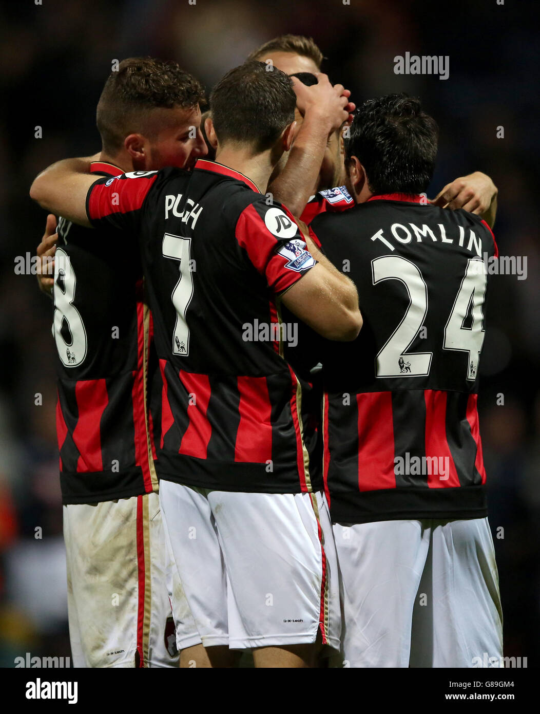 AFC Bournemouth players celebrate after the final whistle during the Capital One Cup, third round match at Deepdale, Preston. Stock Photo