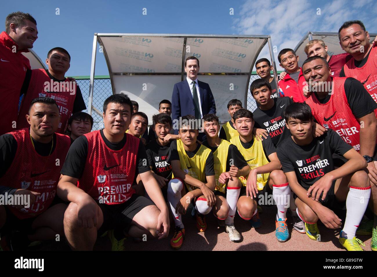 Chancellor of the Exchequer George Osborne meets young apprentice footballers at Soong Ching Ling Football School in the city of Urumqi, north west China, where he announced a &Acirc;&pound;3 million funding boost to train 5000 Chinese football coaches. Stock Photo