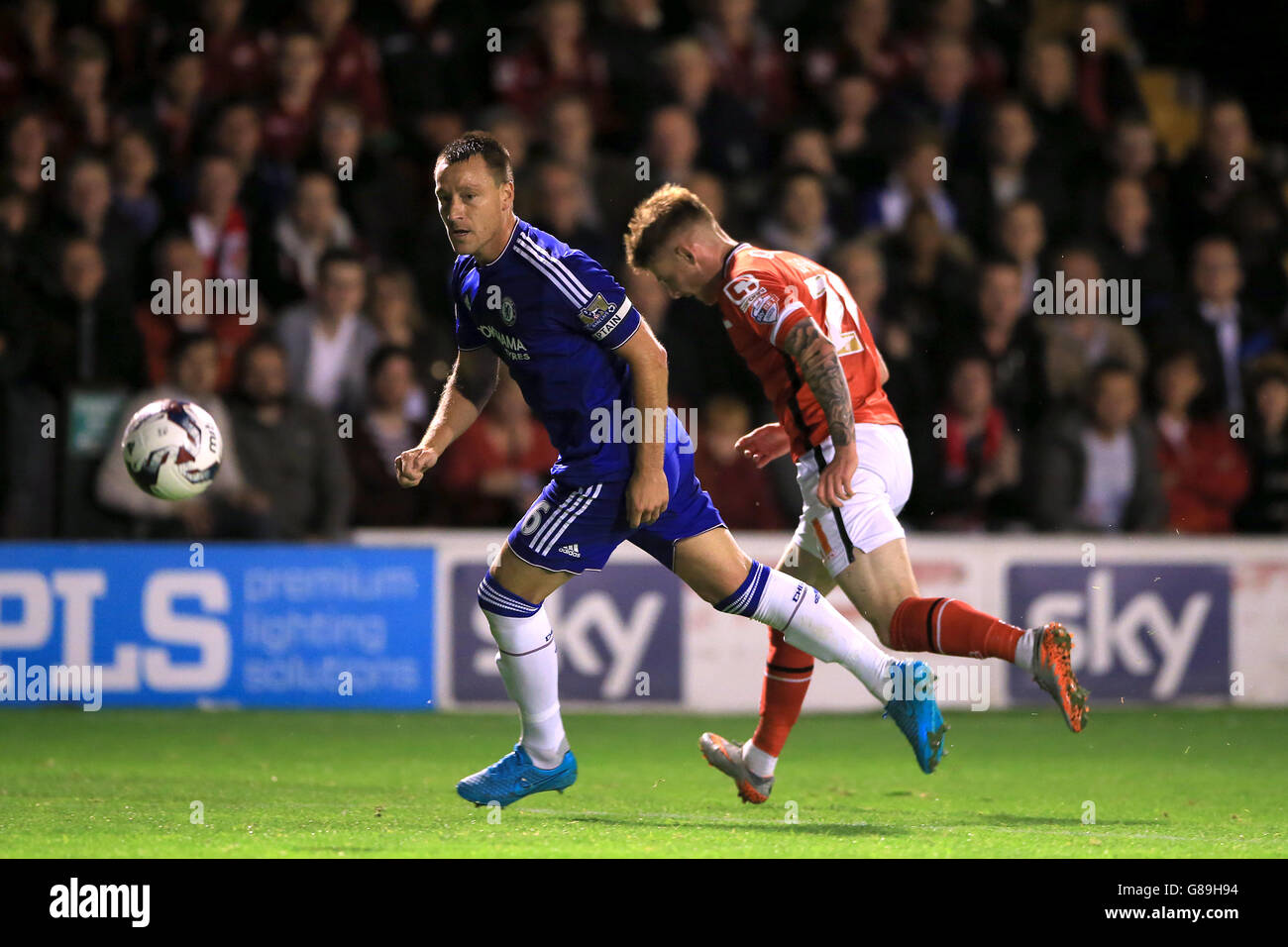 Chelsea's John Terry and Walsall's Jordan Cook (right) battle for the ball during the Capital One Cup, third round match at Banks' Stadium, Walsall. Stock Photo
