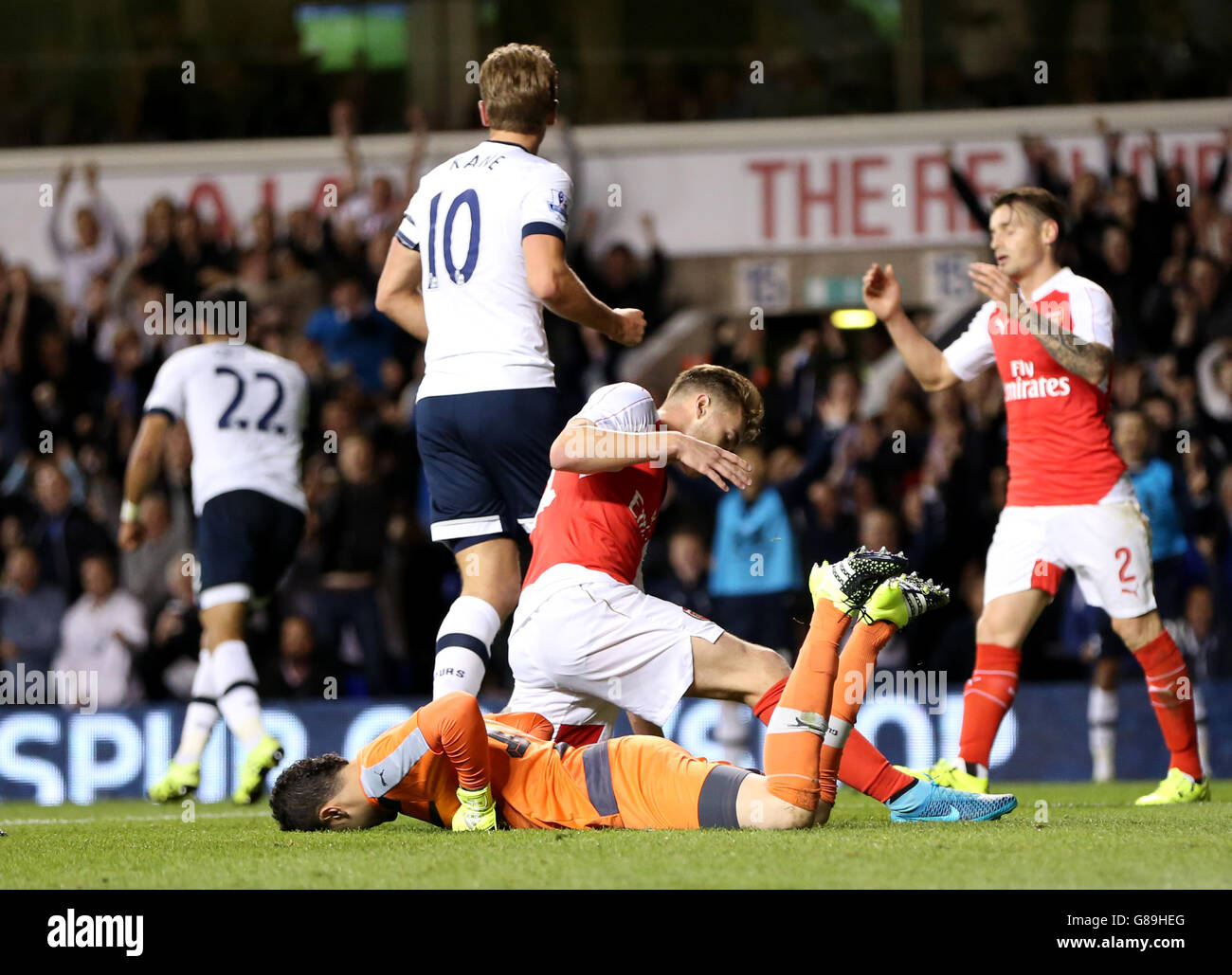 Soccer - Capital One Cup - Third Round - Tottenham Hotspur v Arsenal - White Hart Lane. Arsenal's Calum Chambers (centre) reacts after scoring an own goal Stock Photo