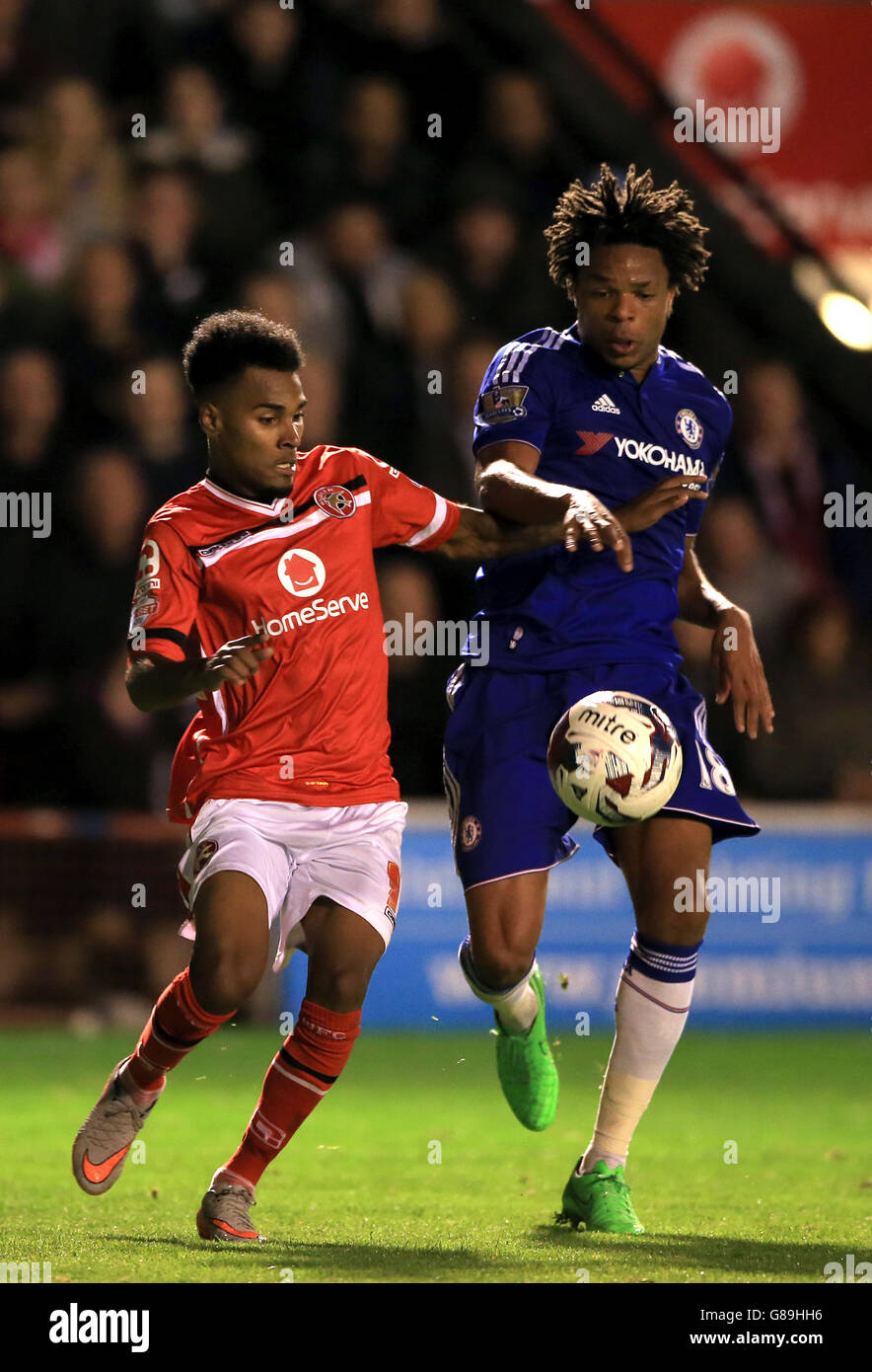 Chelsea's Loic Remy and Walsall's Rico Henry (left) battle for the ball during the Capital One Cup, third round match at Banks' Stadium, Walsall. Stock Photo