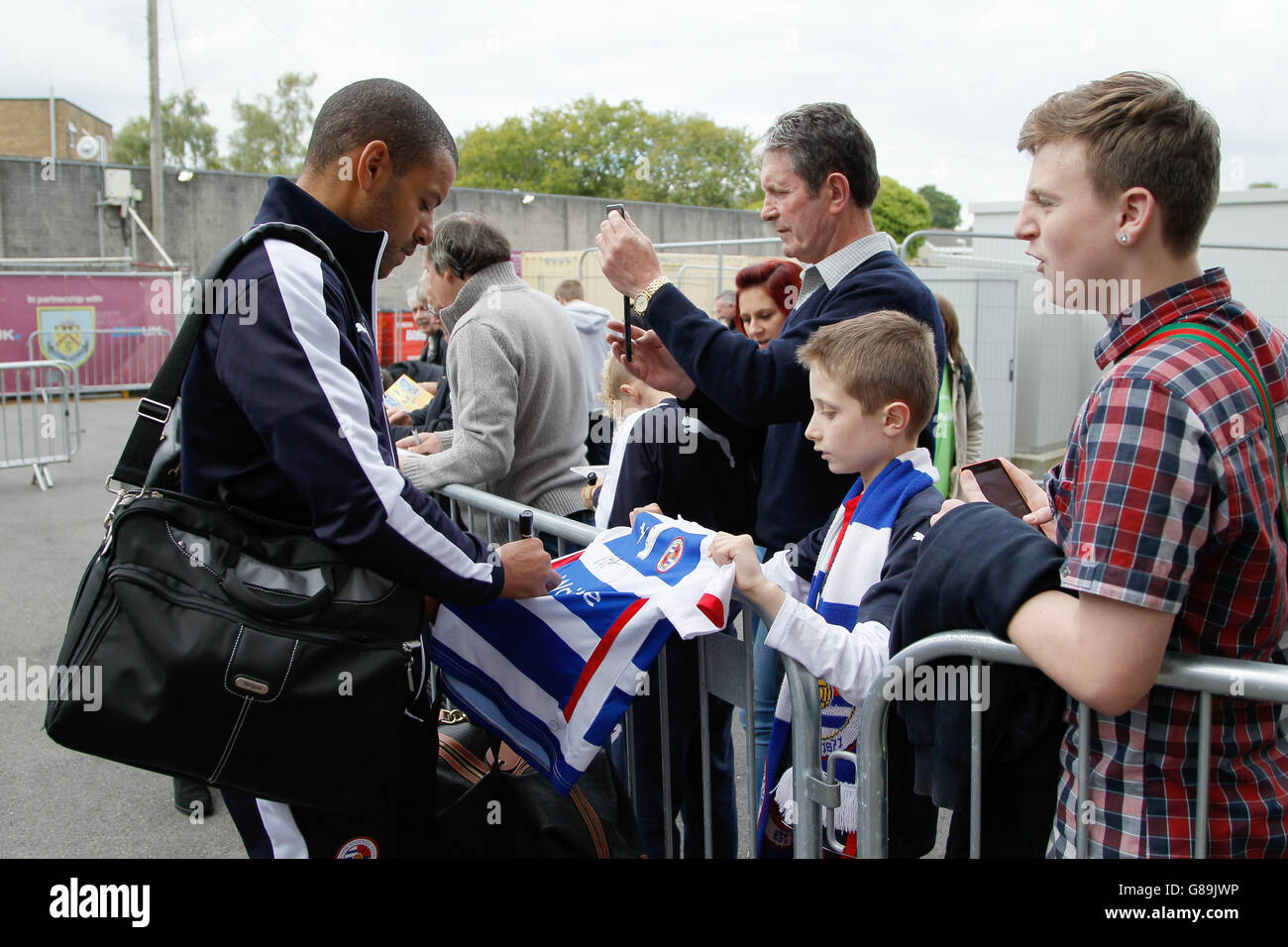Reading's first team coach Stephen Reid signs autographs on arrival at Burnley's Football Ground, Turf Moor Stock Photo