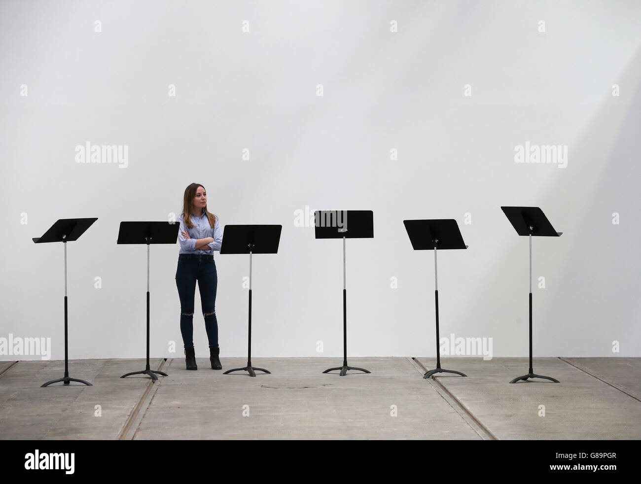 A visitor views the setting used for performances of the operatic work