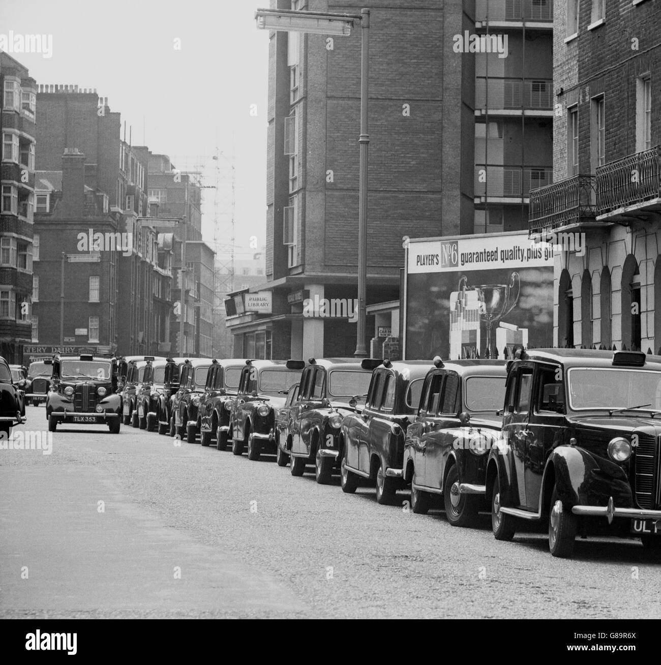 Taxi drivers park their cabs close to St Pancras Town Hall while they attended a mass meeting to protest about the operation of mini cabs. The meeting was organised by the Transport and General Workers' Union. Stock Photo