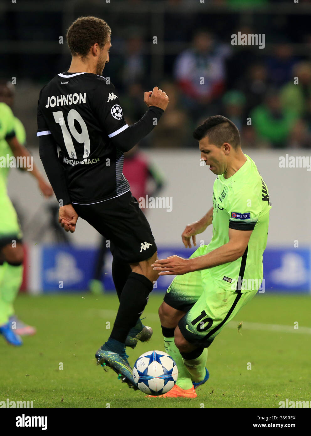 Manchester City's Sergio Aguero (right) is fouled by Borussia Monchengladbach's Fabian Johnson to win his side a penalty Stock Photo