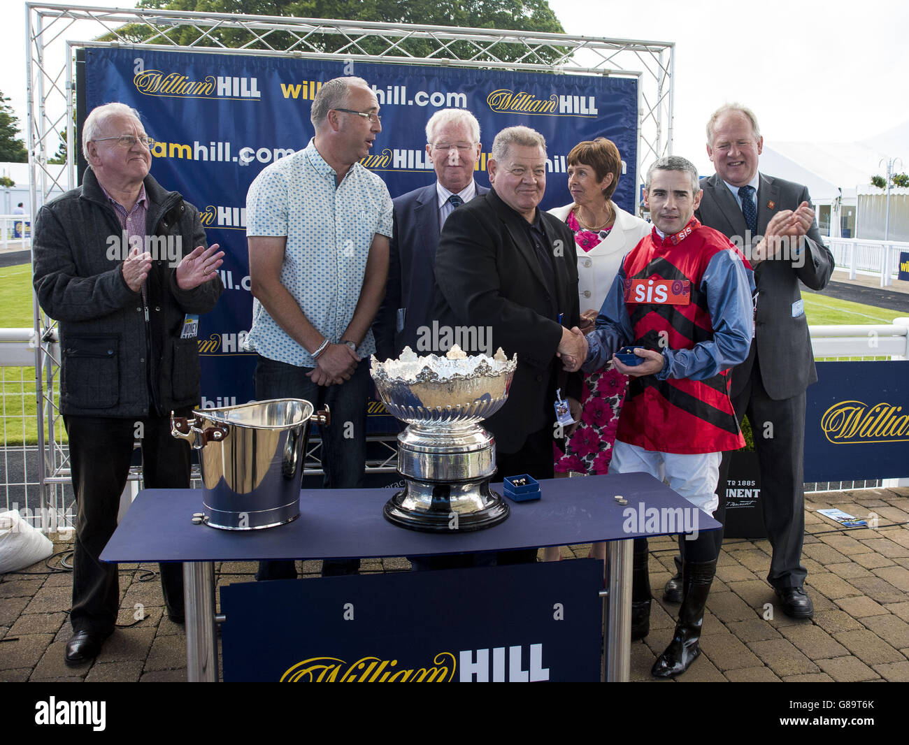 Mistiroc ridden by Feral Lynch, Trained by Jim Goldie and owned by Drew and Ailsa Russell, collect the trophy after winning the William Hill Handicap Stakes during day one of the Gold Cup Festival at Ayr Racecourse. PRESS ASSOCIATION Photo. Picture date: Thursday September 17, 2015. See PA story RACING Ayr. Photo credit should read: Craig Watson/PA Wire Stock Photo