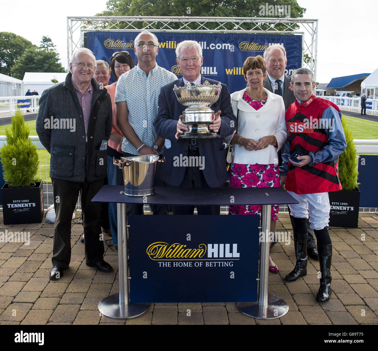 Mistiroc ridden by Feral Lynch, Trained by Jim Goldie and owned by Drew and Ailsa Russell, collect the trophy after winning the William Hill Handicap Stakes during day one of the Gold Cup Festival at Ayr Racecourse. PRESS ASSOCIATION Photo. Picture date: Thursday September 17, 2015. See PA story RACING Ayr. Photo credit should read: Craig Watson/PA Wire Stock Photo