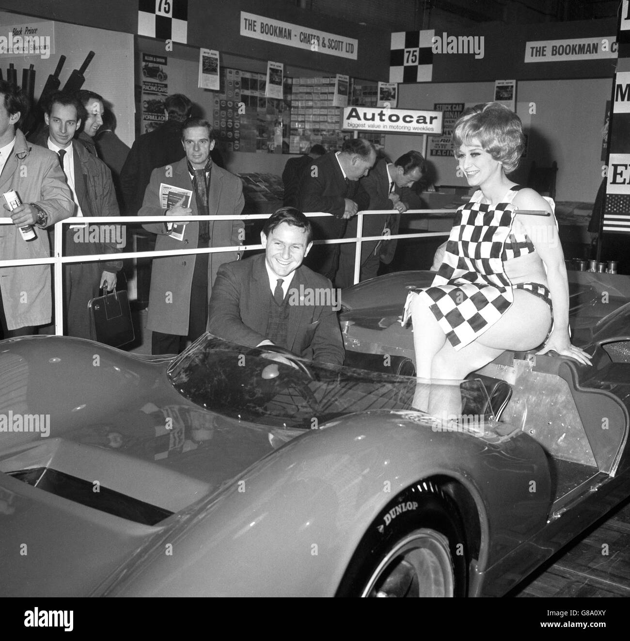 Racing driver Bruce McLaren with the new McLaren-Elva Mk2 V8 sports car at the Racing Car Show at Olympia. With him is Gillian Evans of Maida Vale. Stock Photo
