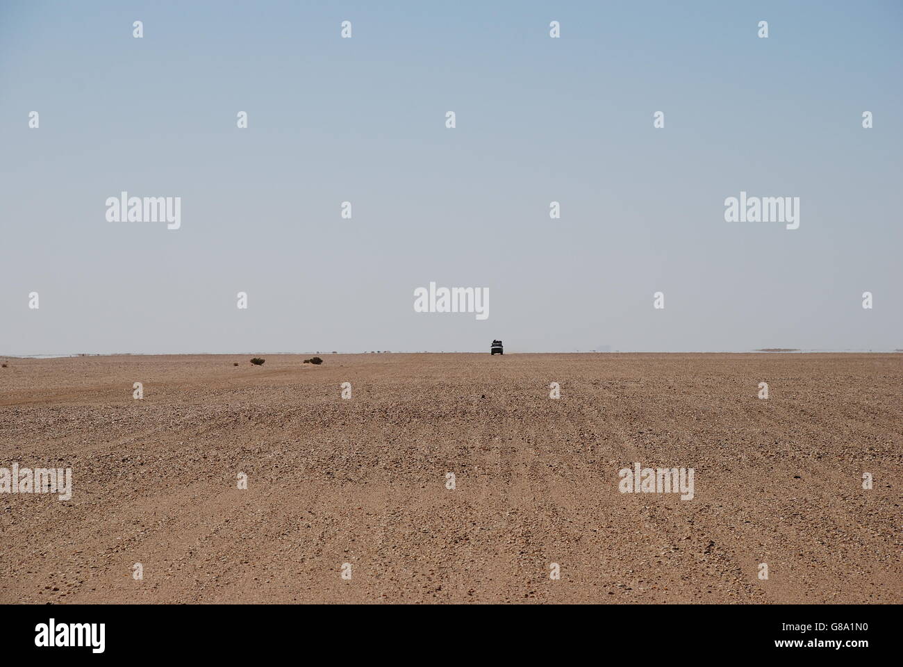desert, Algeria, empty, rocks, stones, plain, blue sky, copy space, isolated, barren, dry Stock Photo