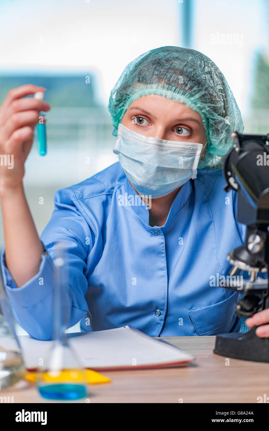 Experienced lab assistant working on chemical solutions Stock Photo Alamy