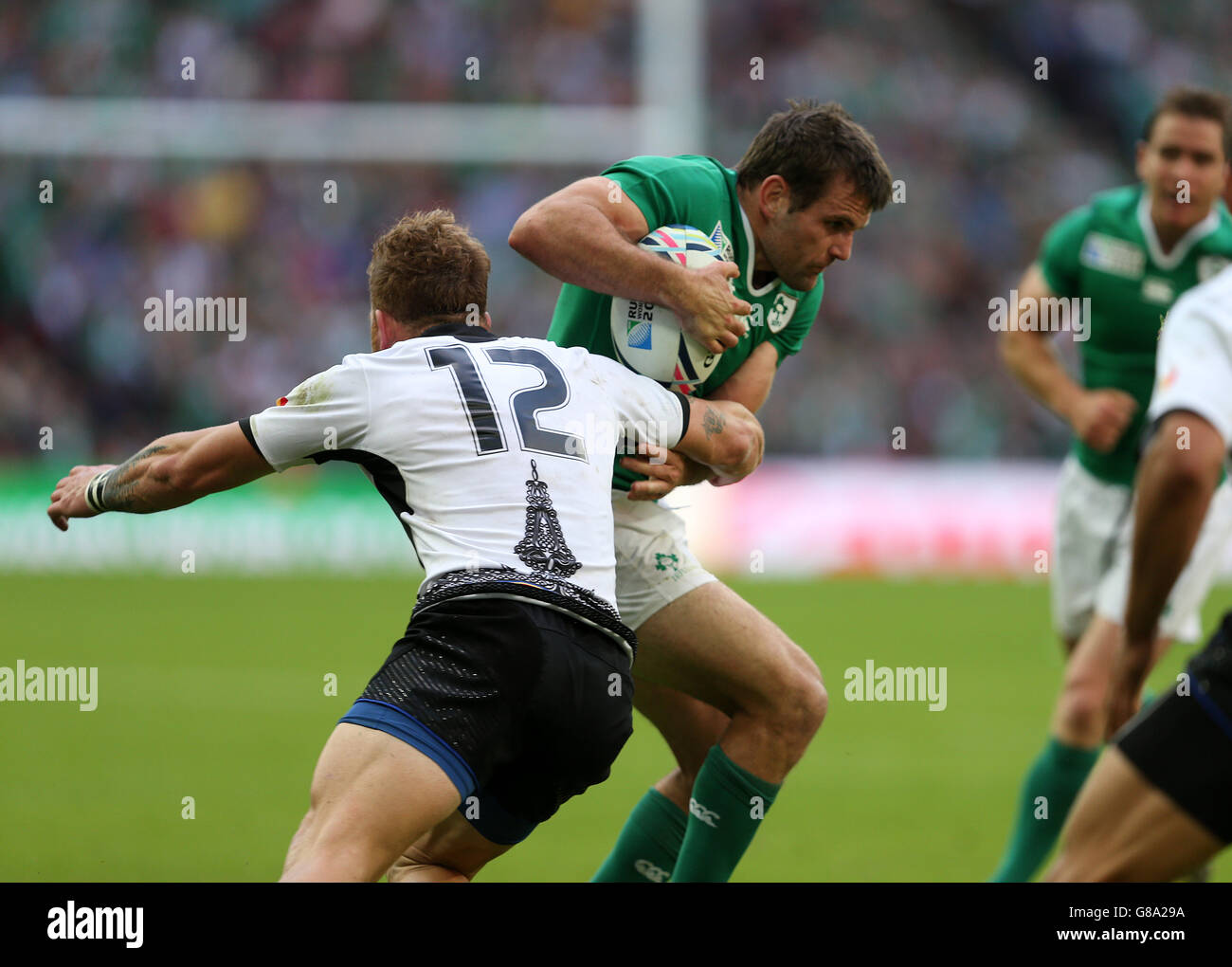Rugby Union - Rugby World Cup 2015 - Pool D - Ireland v Romania - Wembley Stadium. Romania's Csaba Gal (left) tackles Ireland's Jared Payne (right) during the Rugby World Cup match at Wembley Stadium, London. Stock Photo
