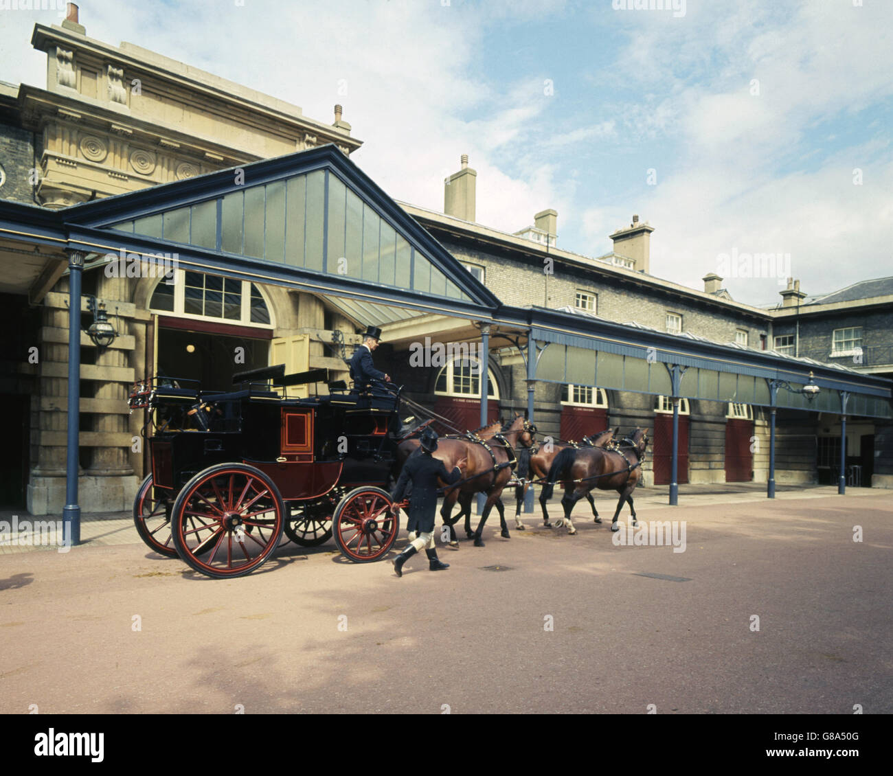 A private drag (or four-in-hand) drawn by a team of horses imported from Germany, pictured at the Royal Mews, London. Stock Photo