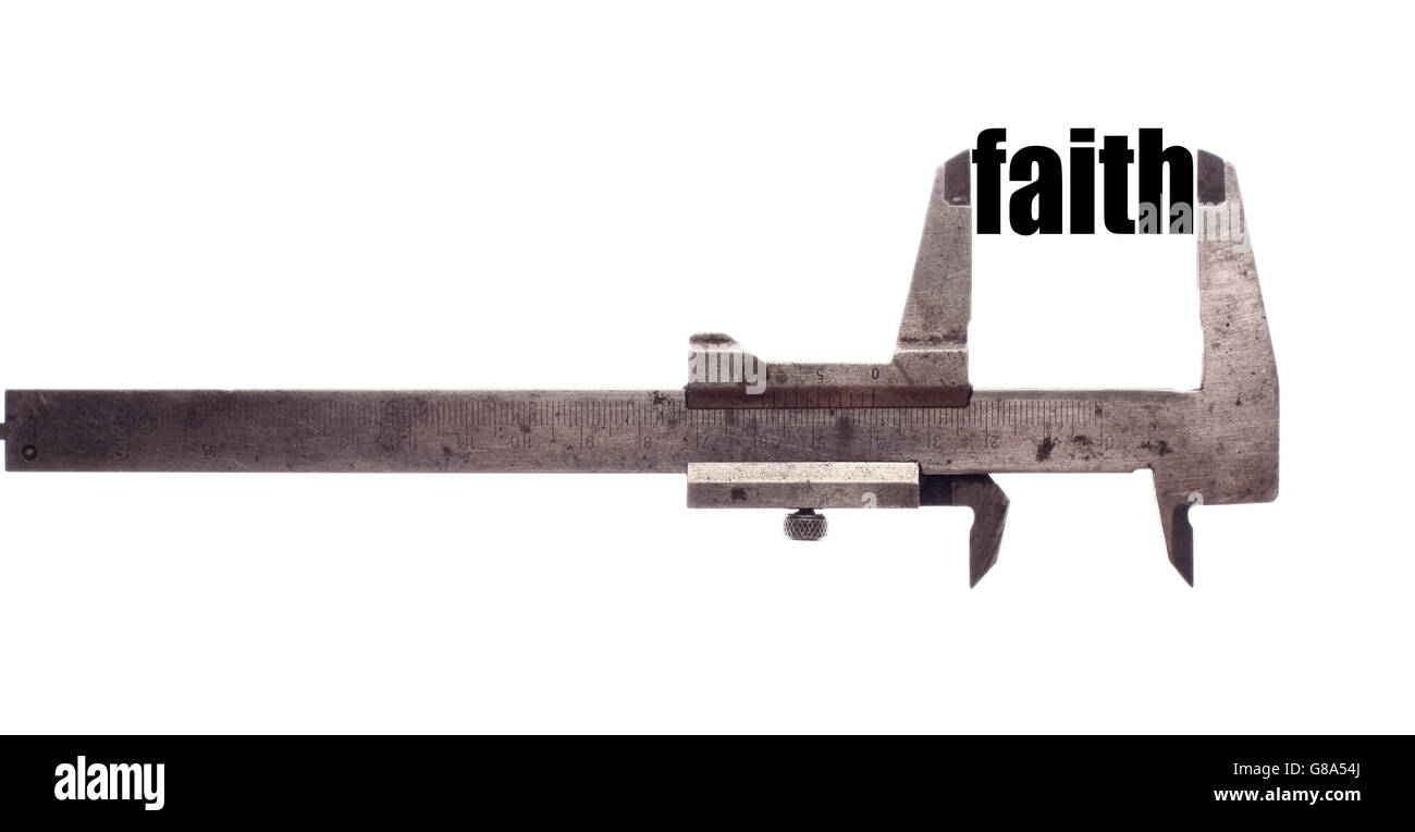 Color horizontal shot of a caliper and measuring the word "faith". Stock Photo