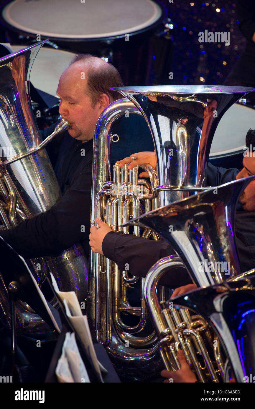 Brass band amateur musicians playing their highly polished  tubas in a concert,UK Stock Photo