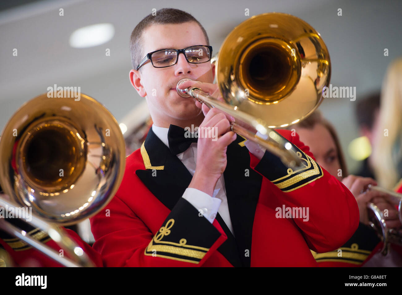 Brass band amateur musicians playing their highly polished  instruments in a concert,UK Stock Photo