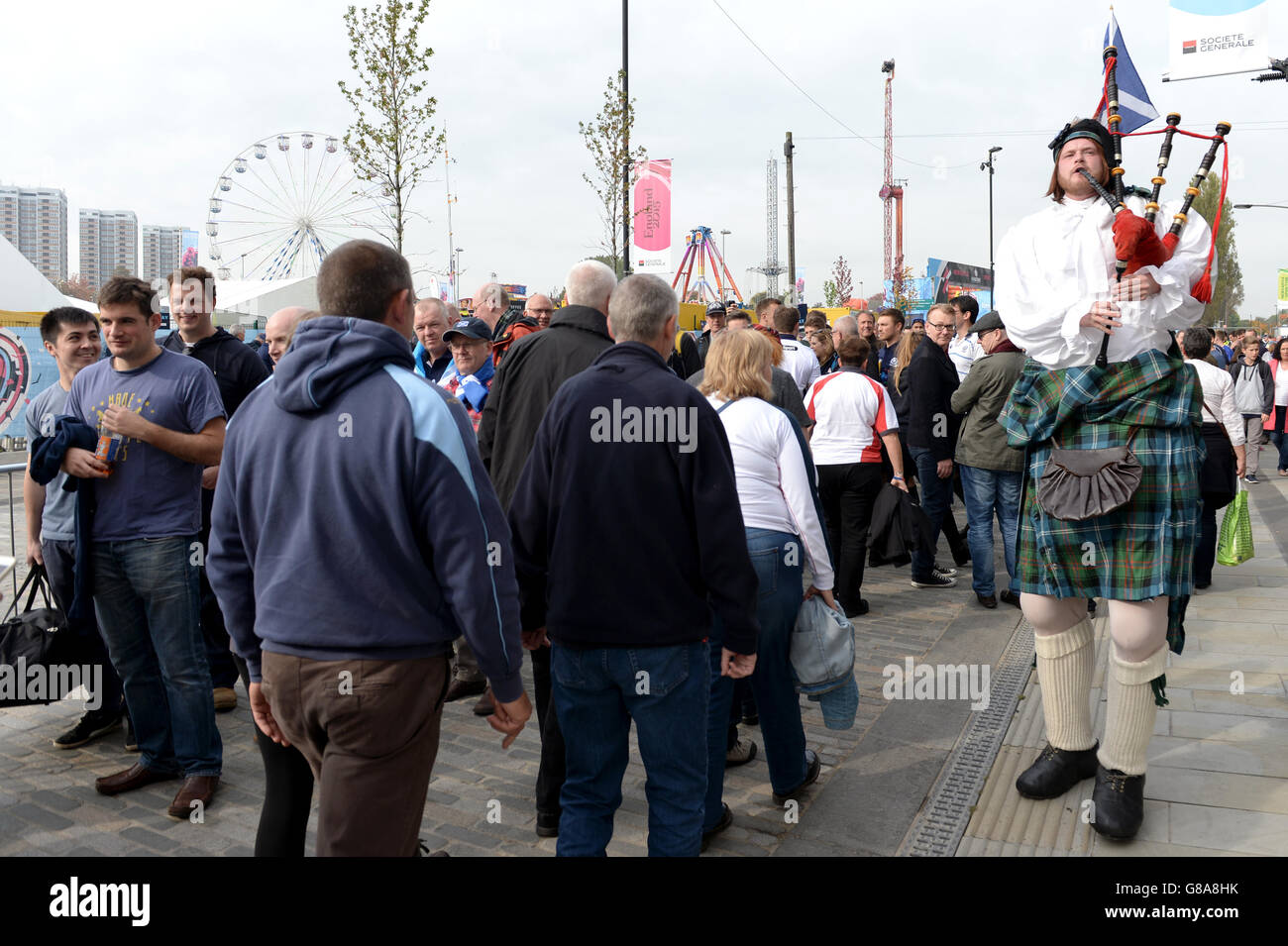 A bagpiper plays outside the fanzone in Newcastle ahead of the World Cup Match at St James' Park, Newcastle. Stock Photo