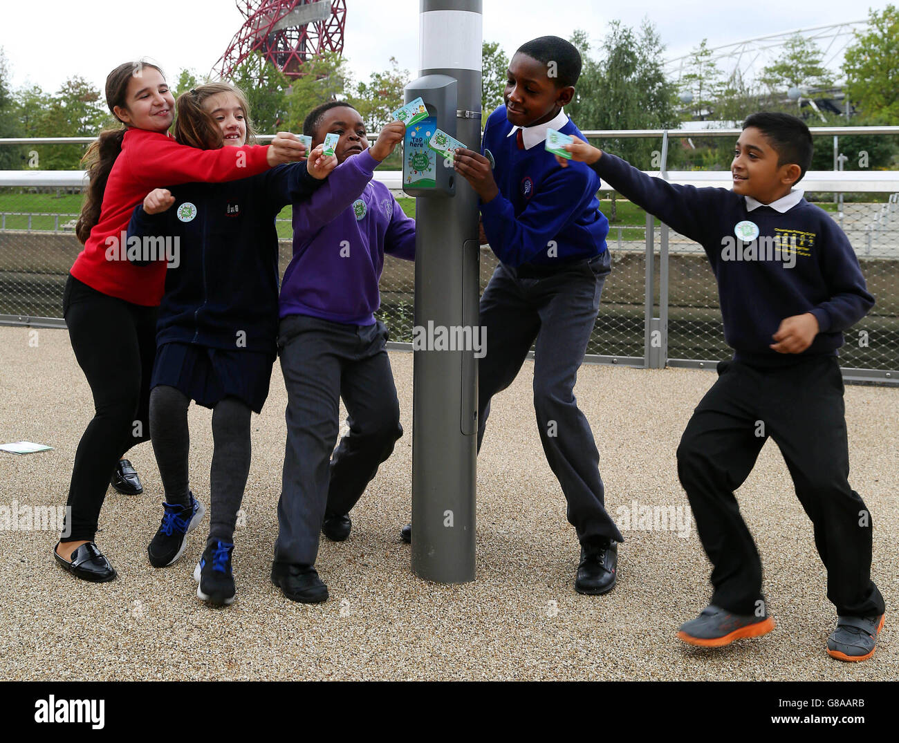 (Left to right) Maria from Sybourn School, Aulona from Manor Primary School, Ronald from St. Dominic's School, Sydney from Berger Primary School and Omar from Chisenhale Primary School, help to launch the Beat the Street campaign, which has been set up by the National Charity Partnership, a partnership between Diabetes UK, British Heart Foundation and Tesco, at the Queen Elizabeth Olympic Park in Stratford, London. Stock Photo