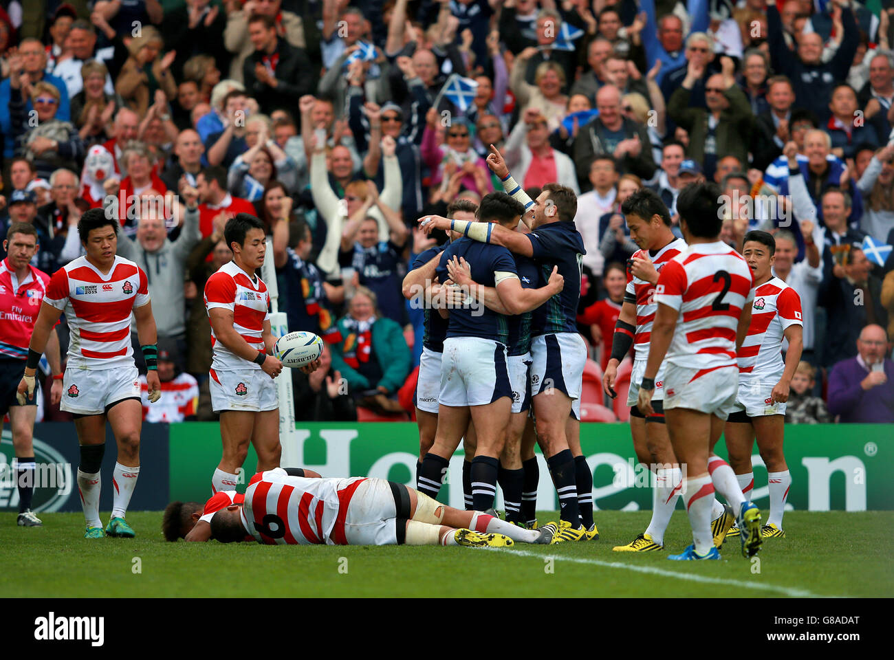 Scotland team celebrate after Mark Bennett scores their third try of the game during the Rugby World Cup match at the Kingsholm Stadium, Gloucester. Picture date: Wednesday September 23, 2015. See PA story RUGBYU Scotland. Photo credit should read: David Davies/PA Wire. Still image use only. Use implies acceptance of Section 6 of RWC 2015 T&Cs at:http://bit.ly/1MPElTL Call +44 (0)1158 447447 for further info. Stock Photo