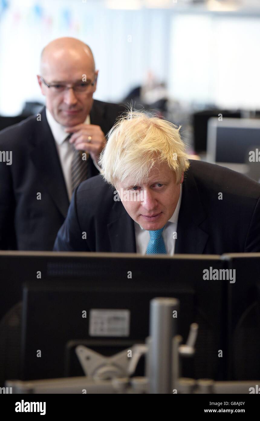 Mayor of London Boris Johnson (right) and Garrett Emmerson, Chief Operating Officer of Surface transport at TFL during a visit to TFL's Traffic Control Centre in Southwark where he was unveiling expanded traffic-busting plans to keep London moving. Stock Photo