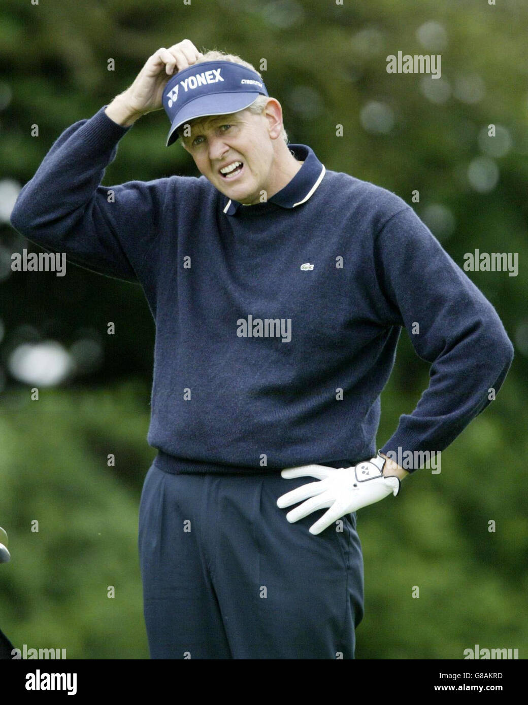 Scotland's Colin Montgomerie scratches his head during the first round. Stock Photo