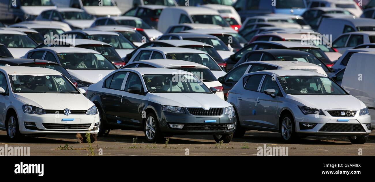 New Volkswagen (left) Skoda (middle) and Seat cars on the dockside in Sheerness, Kent, as it has been reported that high levels of pollution are being emitted by diesel vehicles built by a range of car makers other than Volkswagen. Stock Photo