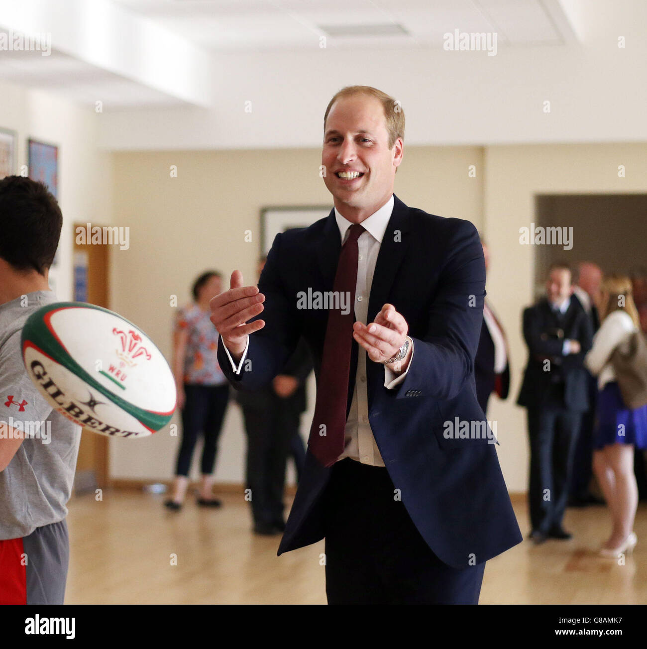 The Duke of Cambridge throws a rugby ball during a visit to the ...