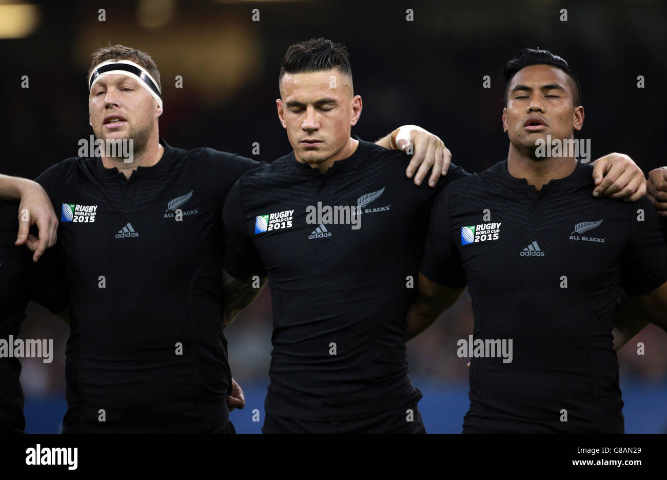 (L-R) New Zealand's Wyatt Crockett, Sonny Bill Williams and Julian Savea during the national anthems before the Rugby World Cup match at the Millennium Stadium, Cardiff. Stock Photo