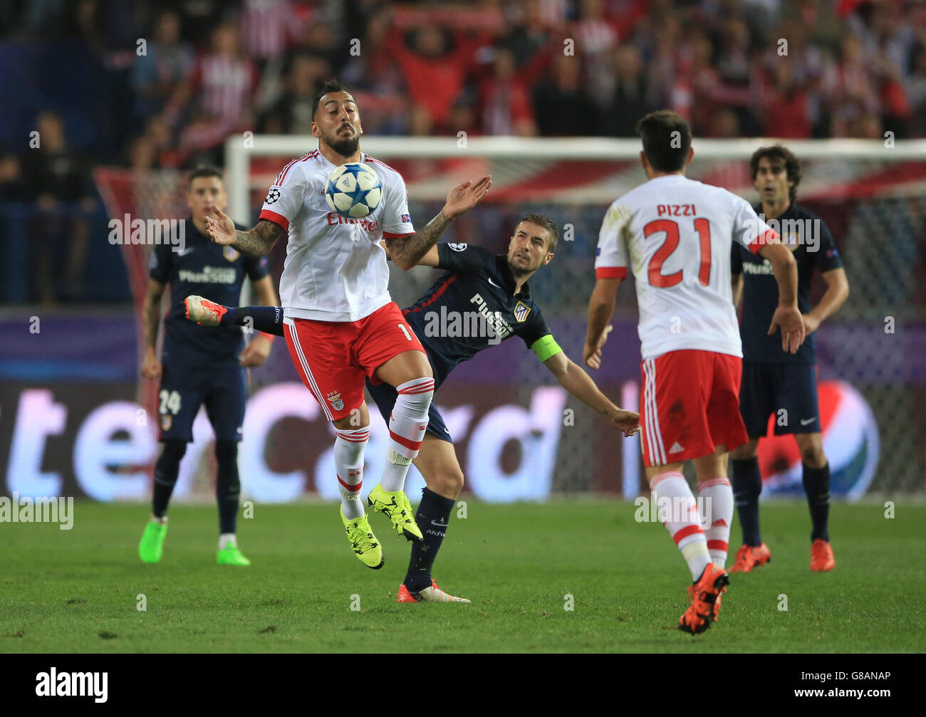 Soccer - UEFA Champions League - Group C - Atletico Madrid v SL Benfica's - Vicente Calderon. Benfica's Kostas Mitroglou controls ball on his chest as his challenged by Atletico Madrid's Gabi Stock Photo