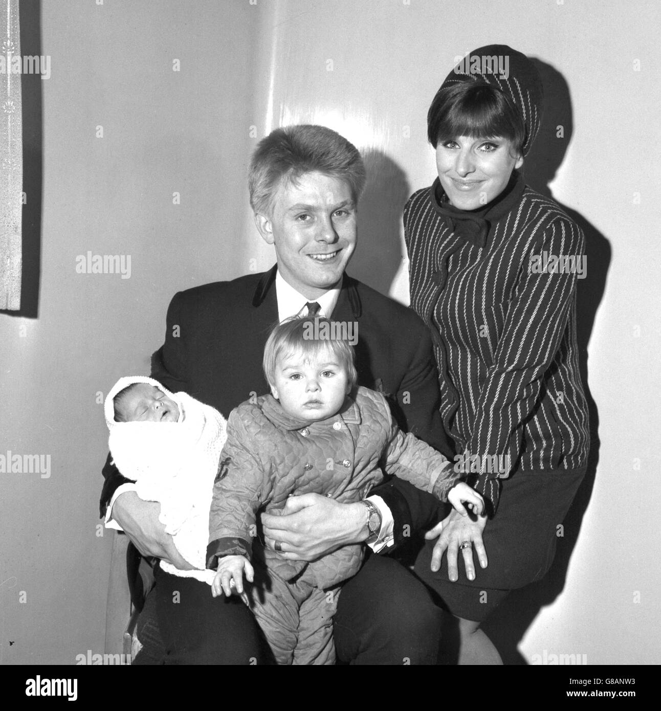 Cockney pop singer Joe Brown with his 25-year-old wife Vicki and his new infant son Peter and 14-month-old daughter Samantha, as they were about to leave Queen Mary's Hospital in Stratford. Peter was born on the night of January 6th while Joe was on stage in the West End show Charlie Girl. Stock Photo
