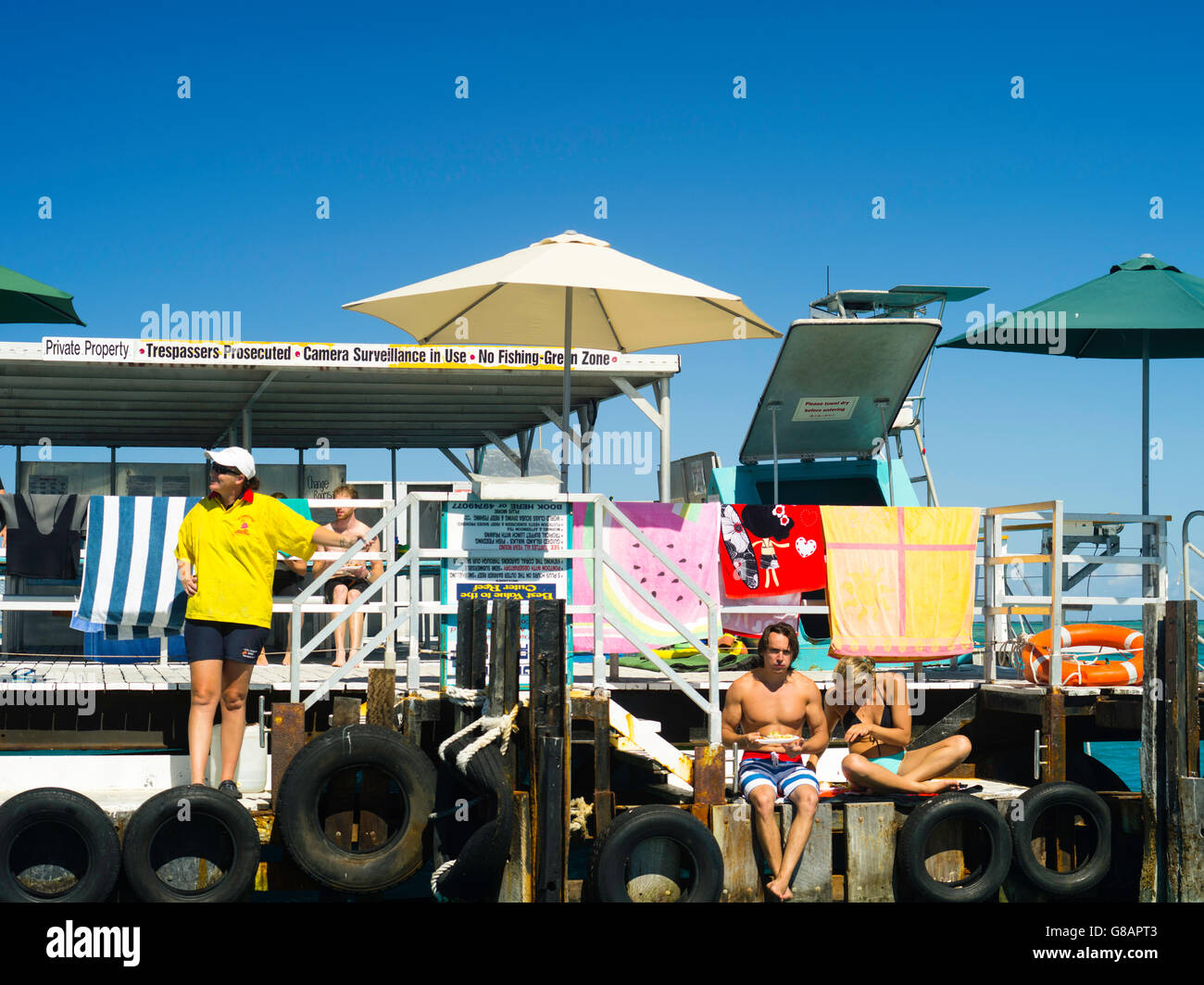 Relaxing and enjoying lunch at Lady Musgrave Island, QLD, Australia Stock Photo