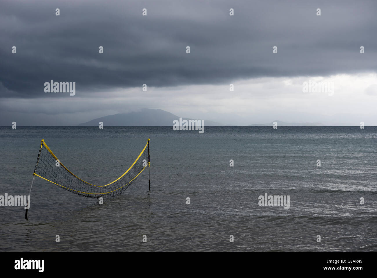 Water volleyball net in ocean during storm, Corfu, Greece Stock Photo