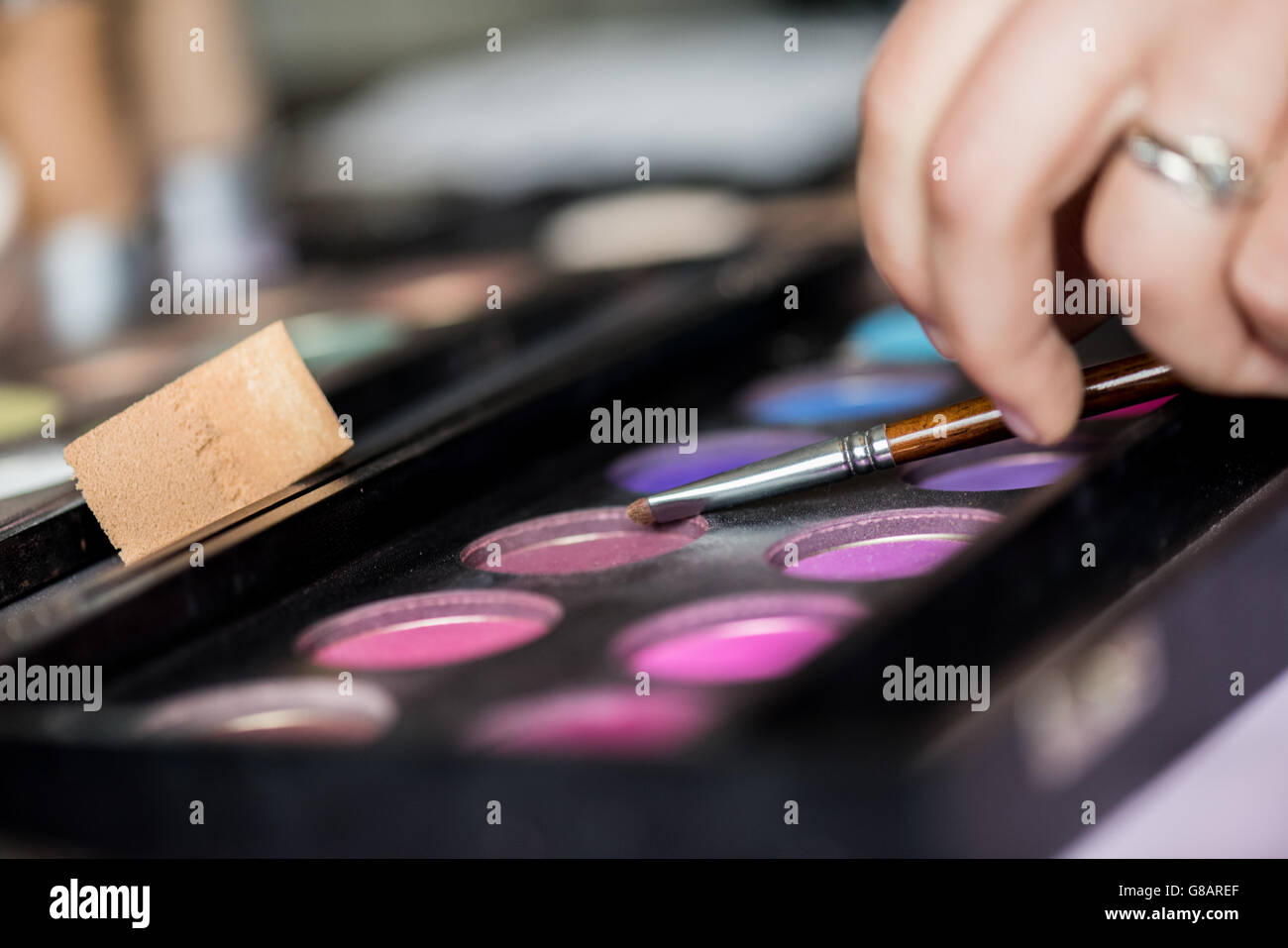 Woman applying eyeshadow Stock Photo