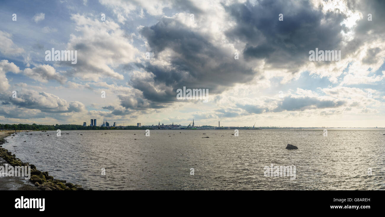 TALLINN, ESTONIA - JUNE 19, 2016: Summertime Tallinn city panorama. Scenic cloudscape over Baltic sea bay. Stock Photo